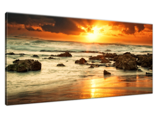 Fotoobraz na stenu Východ slnka nad rozbúreným oceánom