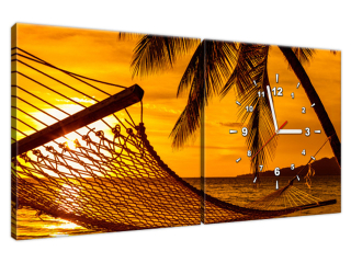 Obraz s hodinami Hojdacia sieť na pláži pri západe slnka
