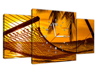 Obraz s hodinami Hojdacia sieť na pláži pri západe slnka